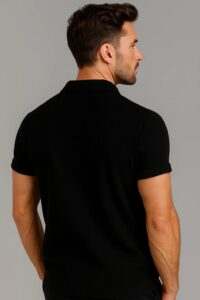 "Man wearing a black short-sleeve polo shirt with ribbed texture and buttoned collar."