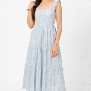 Front view of a woman wearing a sky blue tiered maxi dress with ruffle sleeves Back view of a lace-up tie-back sleeveless summer dress in light blue